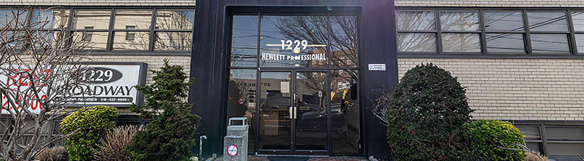The image shows a modern dental clinic interior with various pieces of equipment, including a dental chair and an X-ray machine.