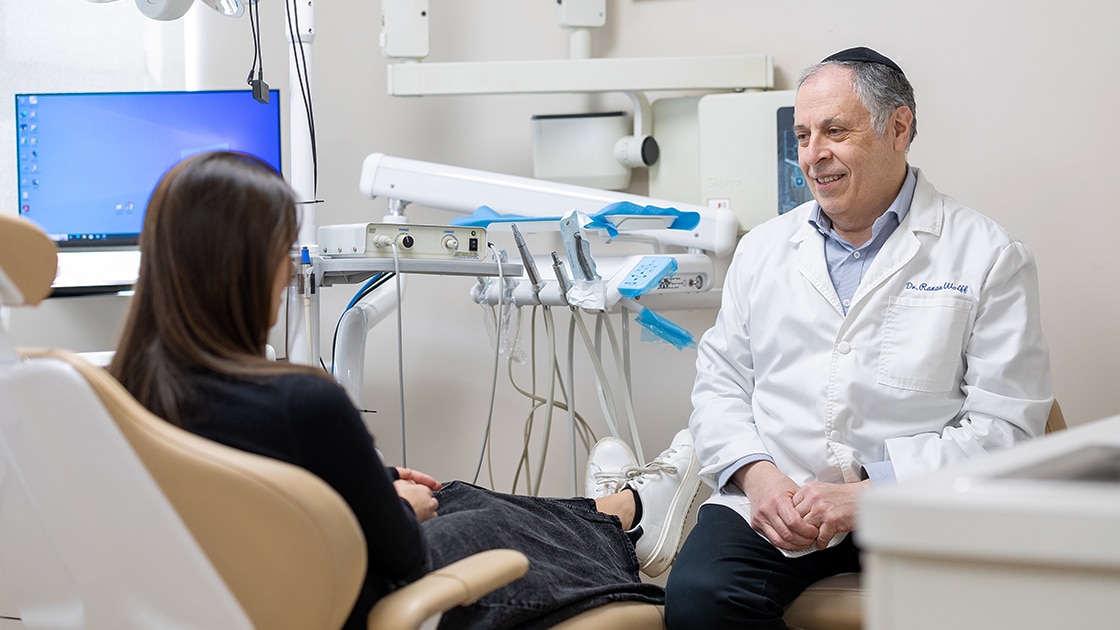 Dr. Hewlett Talking with Patient